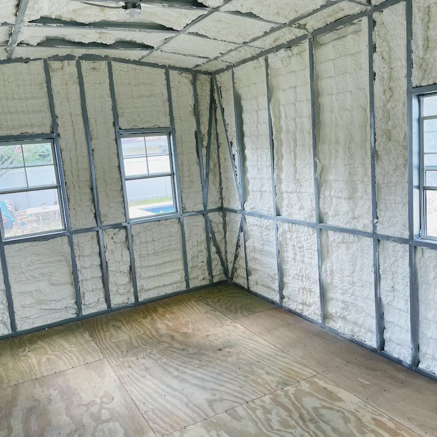 Closed-cell spray foam insulation applied to wall cavities in a residential project in Riverdale Park